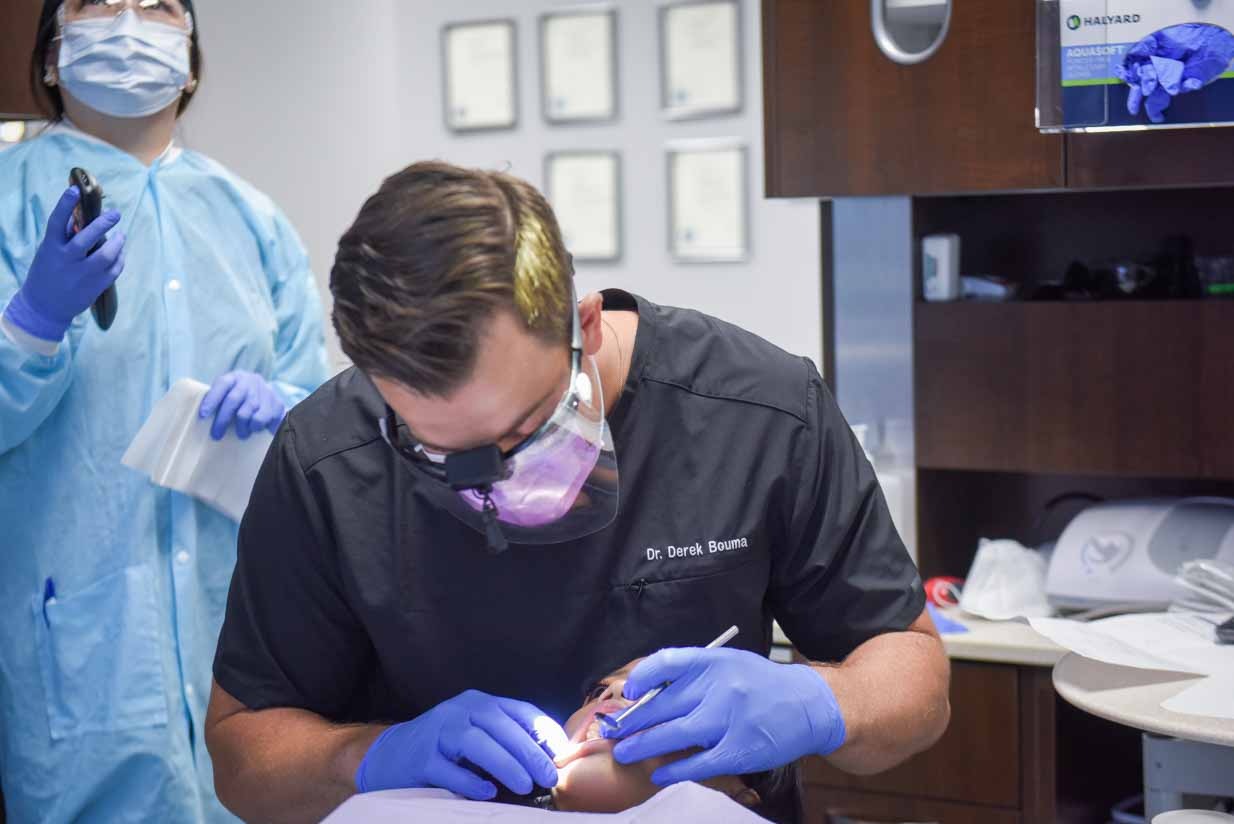 Dr. Derek Bouma working on Patient | NE Calgary Dentists | Pathways Dental Clinic
