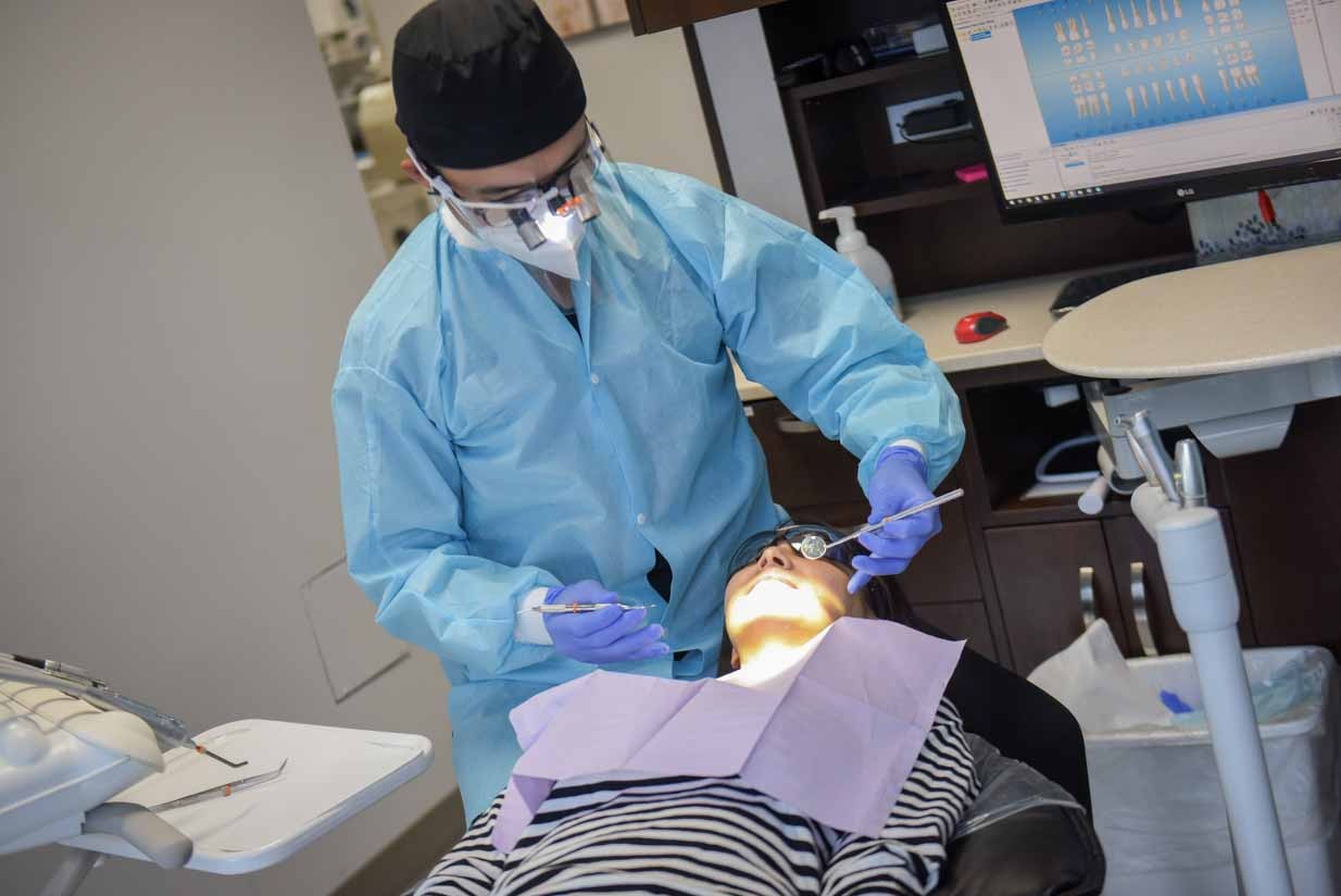 Dr. Tony Kim Working On Patient | NE Calgary Dentists | Pathways Dental Clinic | Calgary Emergency Dental Care