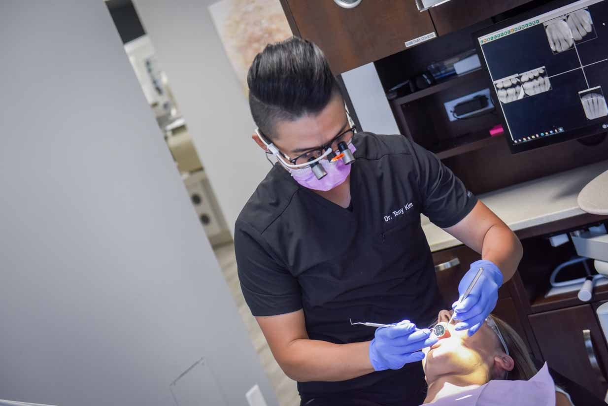 Dr. Tony Kim Working on Patient | NE Calgary Dentists | Pathways Dental Clinic